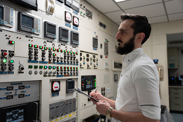 A reactor operator surveys readouts in the University of Missouri Research Reactor control room.