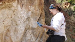 University of Missouri scientist Brandi L. MacDonald collects ochre and clay raw materials in Eswatini, southern Africa, for the study.